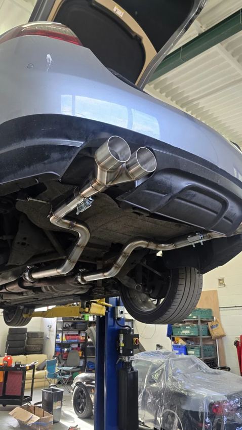Exhaust system fitted underneath a car